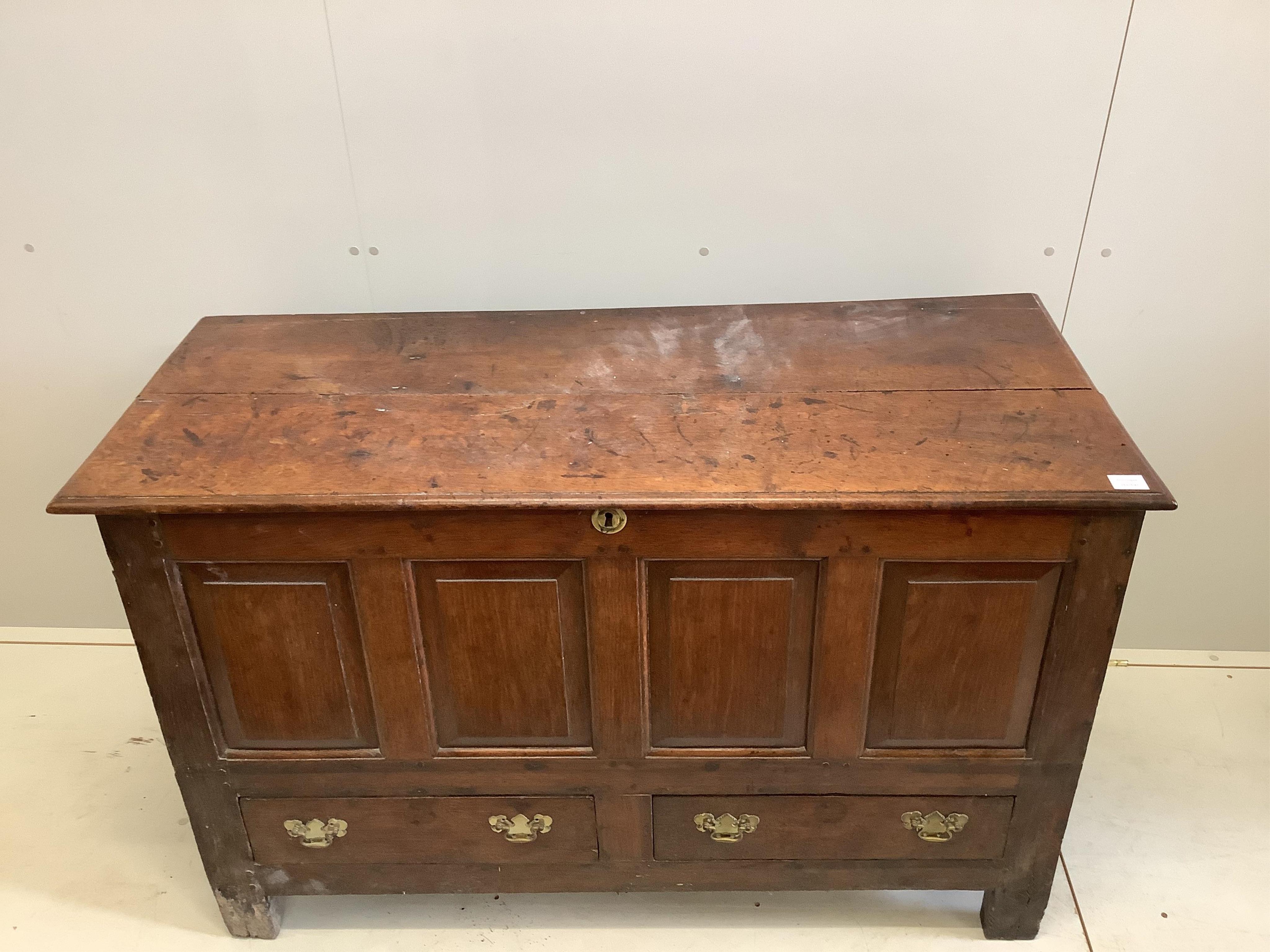 A mid 18th century panelled oak mule chest, width 136cm, depth 58cm, height 87cm. Condition - fair